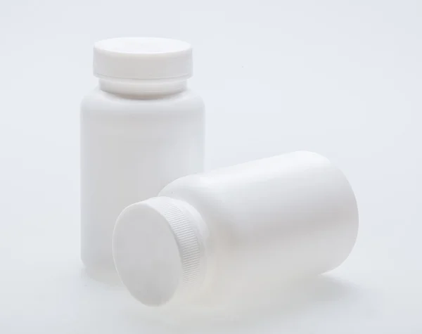 Leere weiße Medizinflasche — Stockfoto