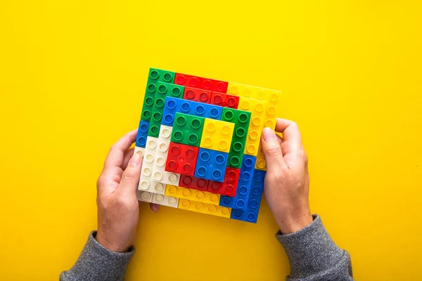 Hand Stacking Colorful Plastic Block — Stock Photo, Image
