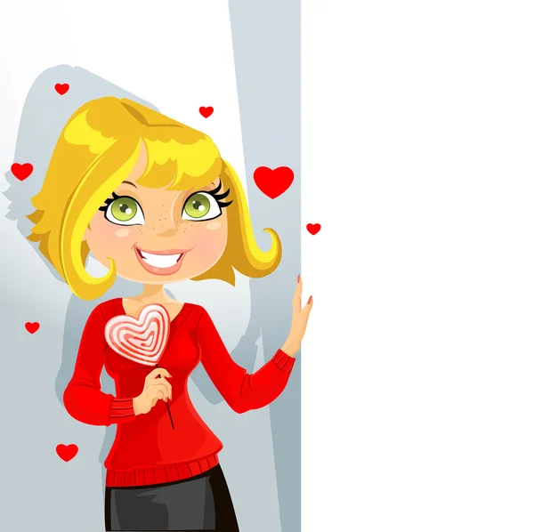 Cute blond girl with sweet candy-heart keeps banner for your text — Stock Vector