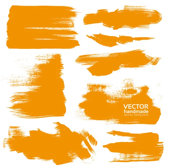 Hand-drawing orange textures of brush strokes in random shape — Stock Vector
