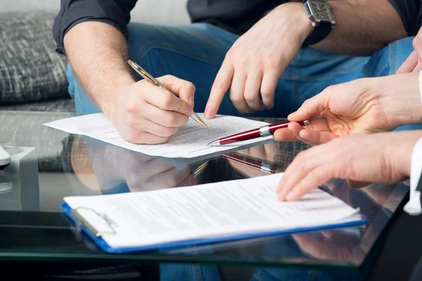 Two signing a document — Stock Photo, Image