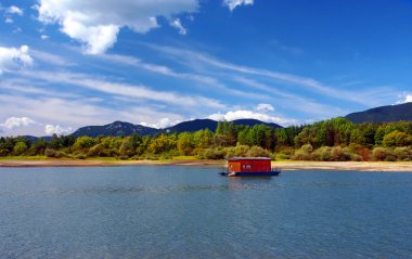 Houseboat and mountains in summer clipart