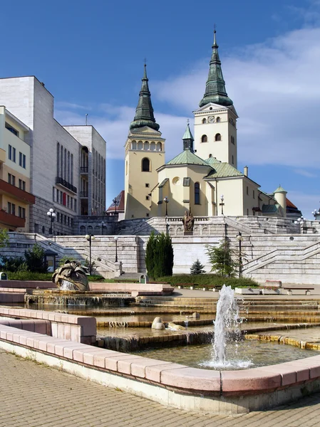 Church, theatre and fountain in Zilina — Stock Photo, Image