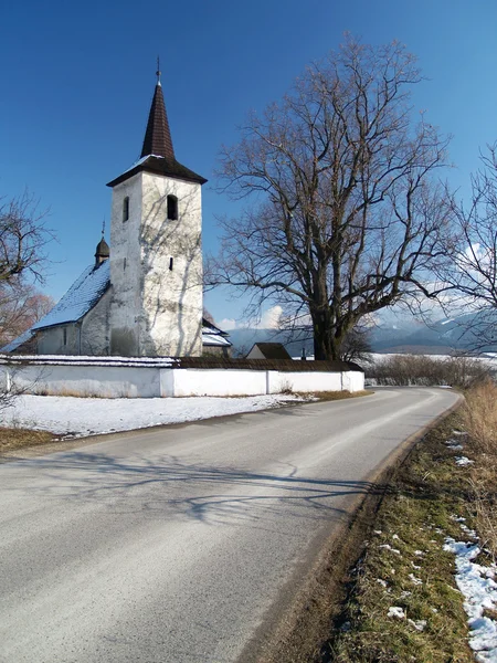 Winter road to church in Ludrova — Stock Photo, Image