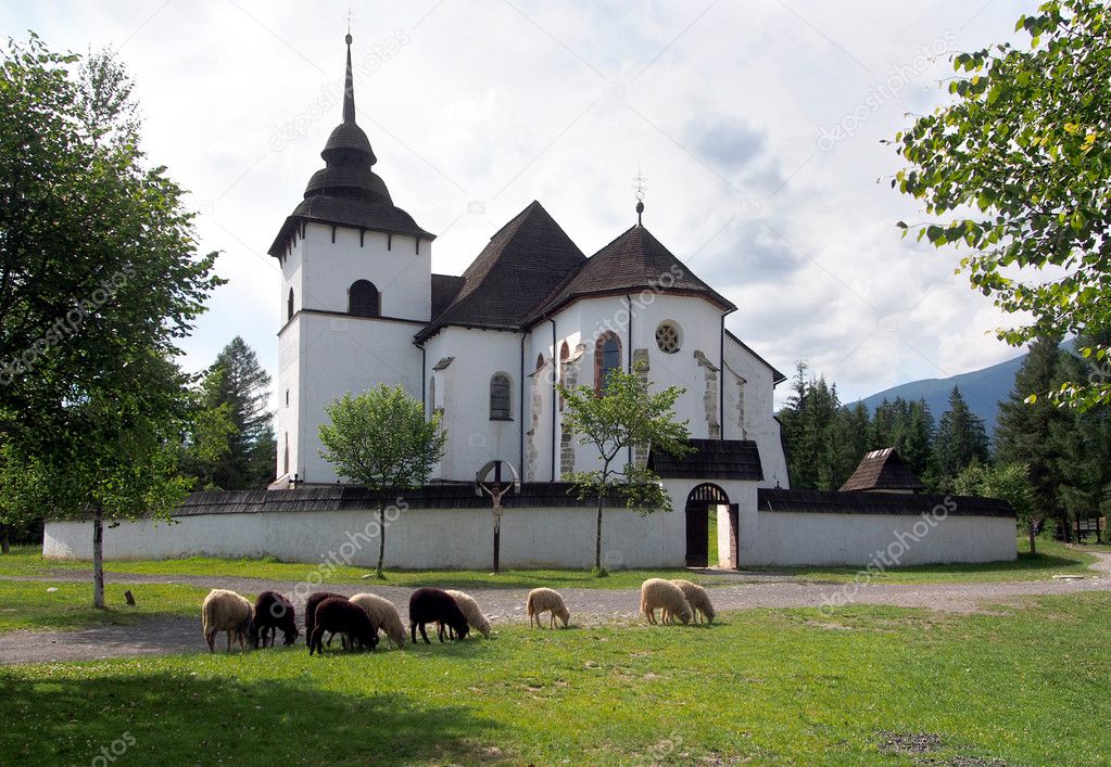 Gothic church in Pribylina with sheep