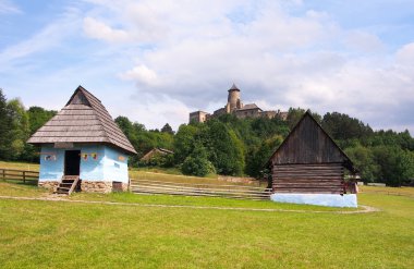 A folk houses and castle in Stara Lubovna clipart