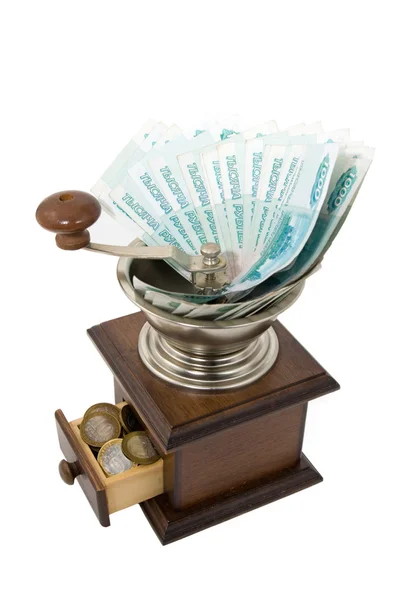 La depreciación del dinero - molinillo marrón con dinero ruso en un wh —  Fotos de Stock