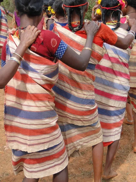 Village women link arms for Gdaba harvest dance