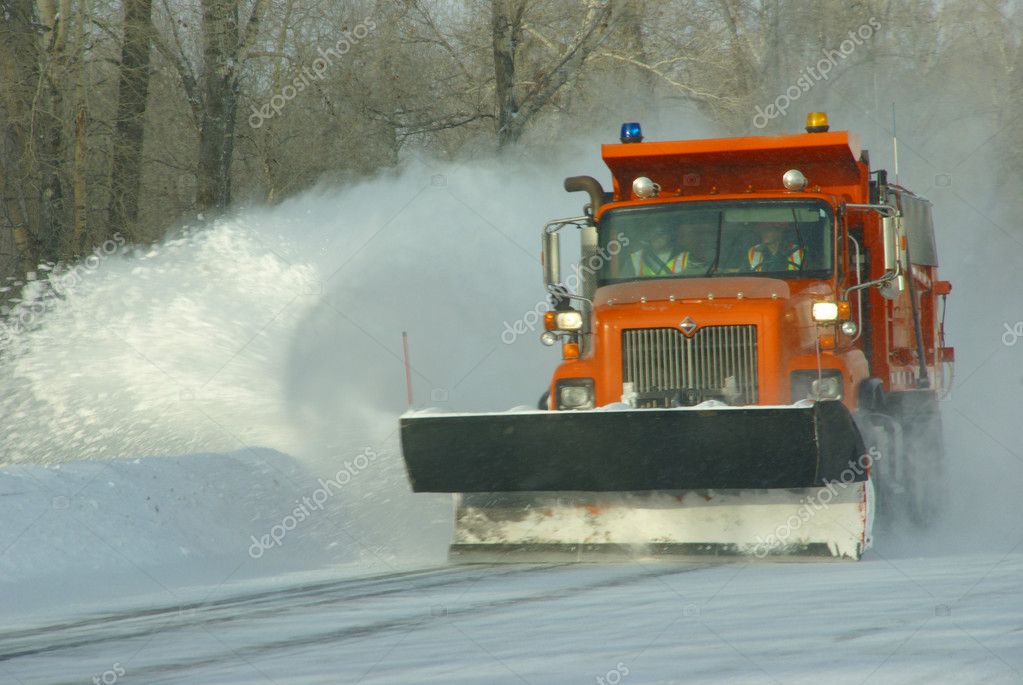 Orange snow plows clearing highway — Stock Photo © cascoly 37981141