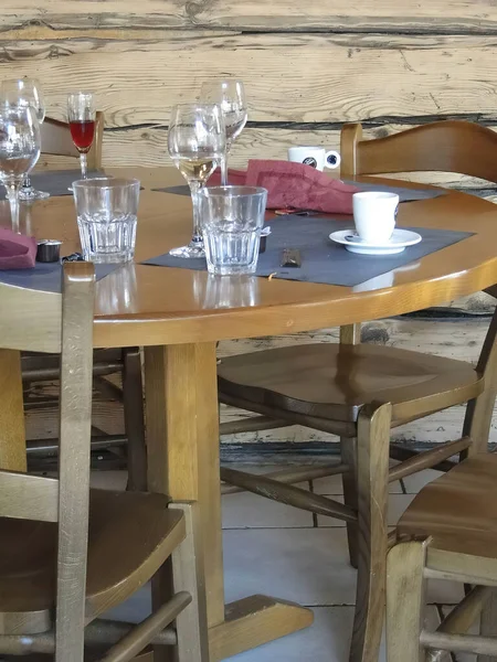 Empty glasses on restaurant table in ski resort at   Chatel,  France