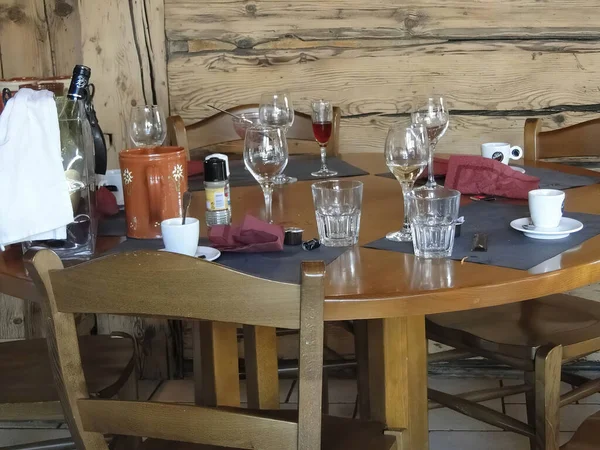 Empty glasses on restaurant table in ski resort at   Chatel,  France