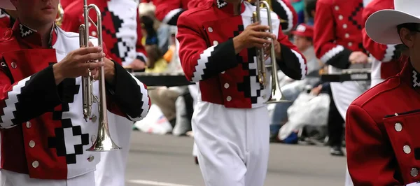 Red trombone players in marching bandCalgary Stampede ParadeCalgaryAlberta