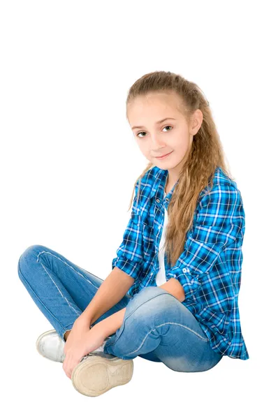 Das Mädchen in Jeans und kariertem Hemd — Stockfoto