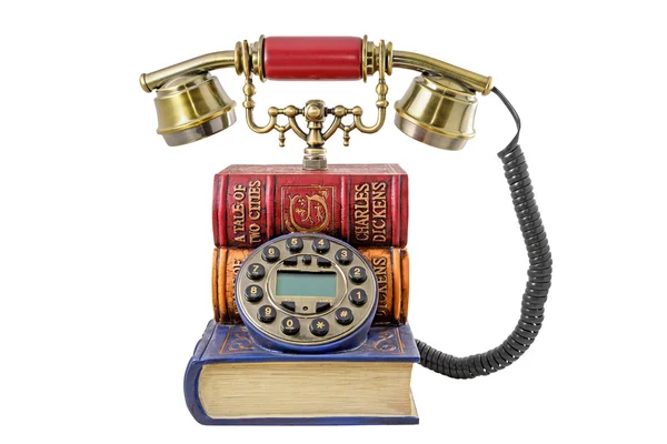 Phone stylized under a pile of books — Stock Photo, Image