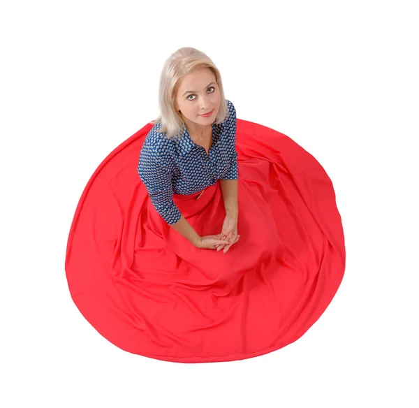 The beautiful blonde in a red skirt — Stock Photo, Image