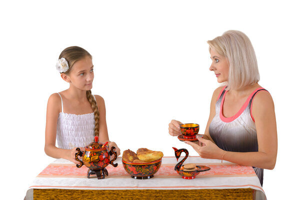 Mother and daughter drinking tea