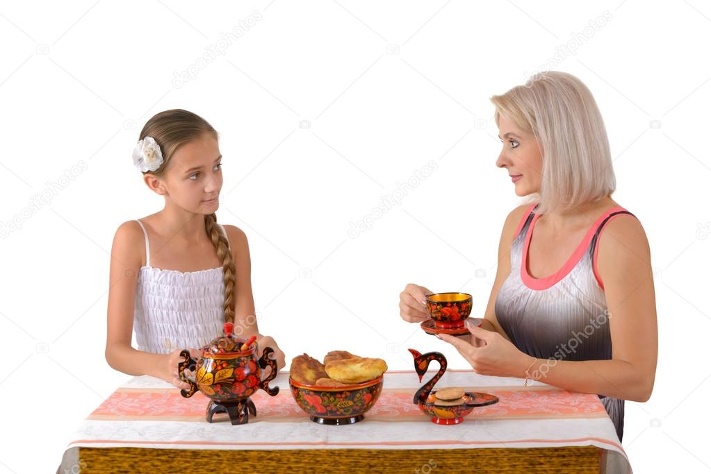 Mother and daughter drinking tea