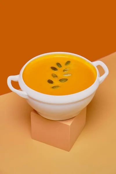 Pumpkin Soup Decorated Pumpkin Seeds Isolated Orange Background Monochrome Minimalism — Stock Photo, Image