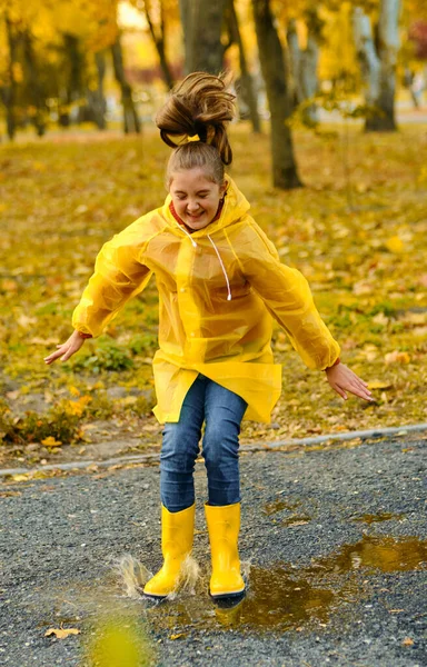 Happy Child Girl Yellow Raincoat Rubber Boots Jumping Puddle Autumn — Stock Photo, Image