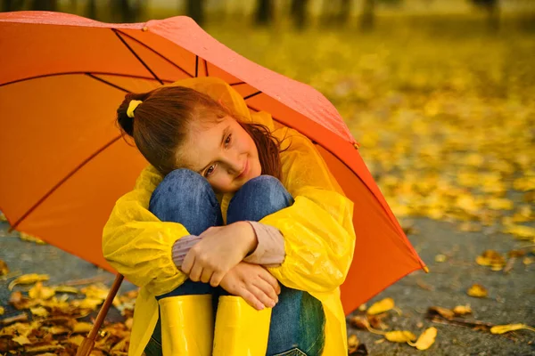 Little Girl Sitting Asphalt Orange Umbrella Rain Autumn Outdoor Fun — Stock Photo, Image