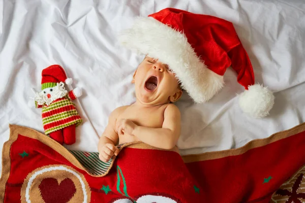 Little Crying Newborn Baby Wearing Santa Hat Lies Red Christmas — Stock Photo, Image