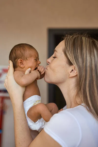 Close Happy Young Mother Holding Head Newborn Baby Kissing Her — Photo