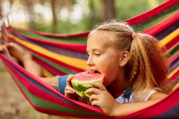 Cute Little Girl Resting Colored Hammock Forest Eating Fresh Watermelon — Stock Photo, Image