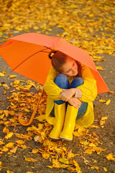Happy Kid Sits Orange Umbrella Autumn Park — Stock Photo, Image