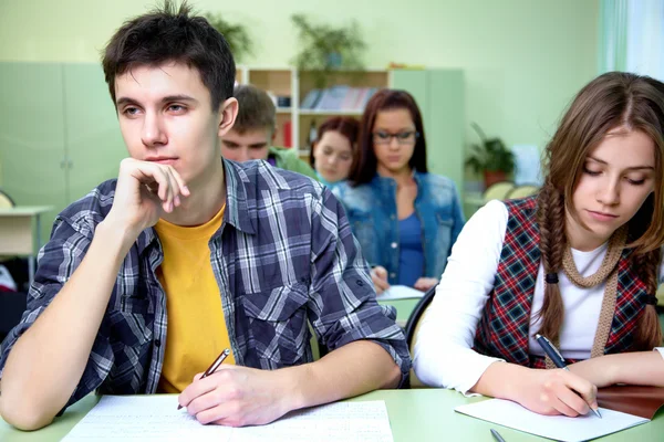 Students on exam in class — Stock Photo, Image