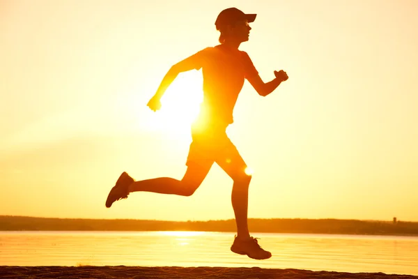 Runner at sunset — Stock Photo, Image