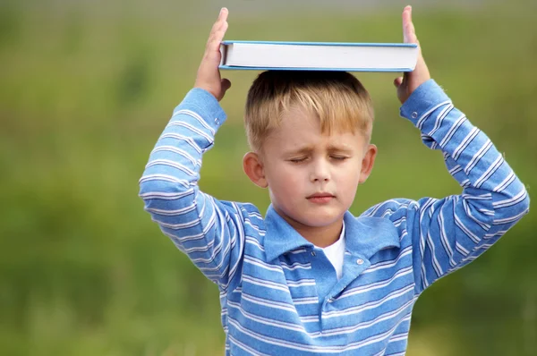 Schoolboy is meditating — Stock Photo, Image