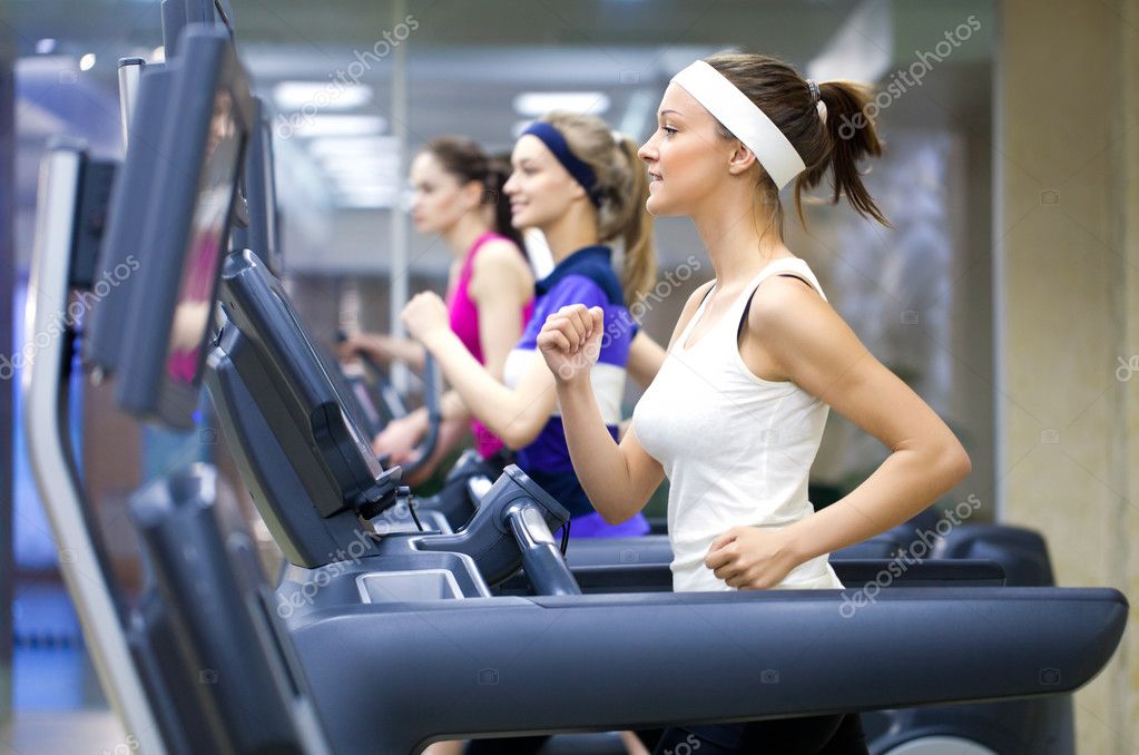 Running in gym Stock Photo by ©yanlev 24690365
