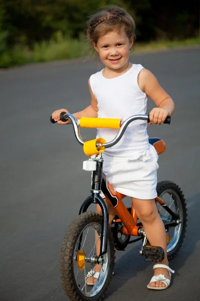 Little girl on a bicycle — Stock Photo, Image