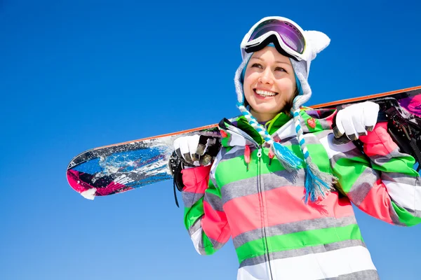 Женщина с сноубордом — стоковое фото