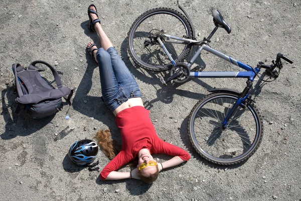 Woman cyclist rests