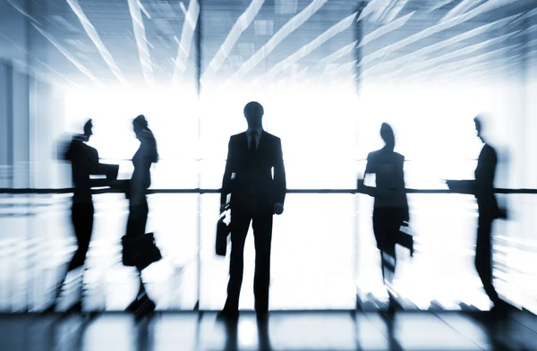 Silhouettes of businesspeople — Stock Photo, Image