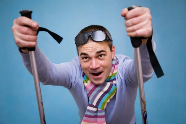 Man in sunglasses with ski sticks — Stock Photo, Image