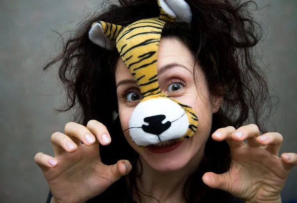 Woman in a mask of a tiger — Stock Photo, Image
