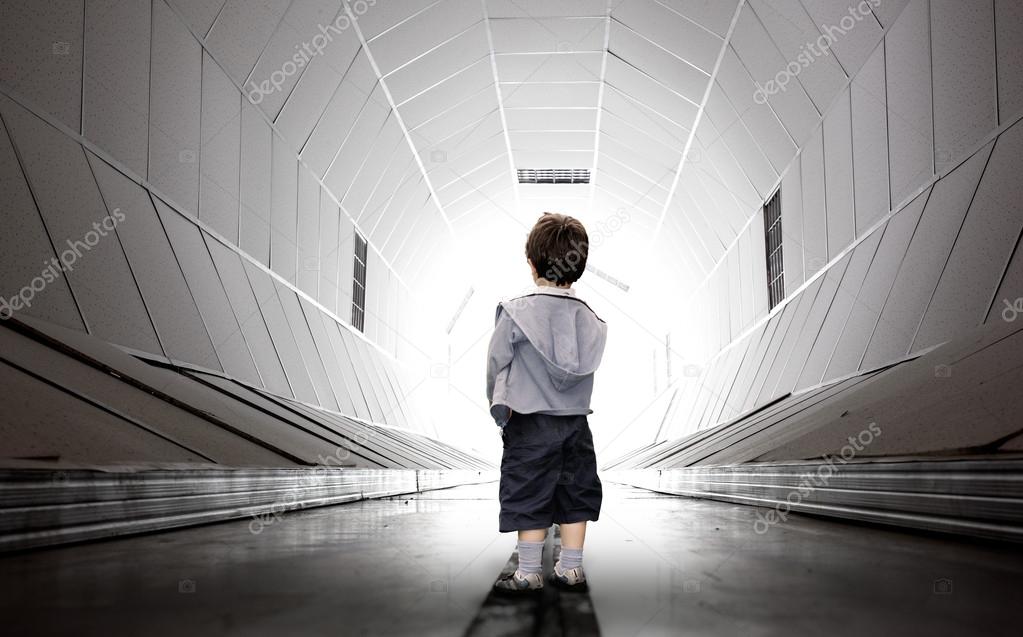 Child walking towards the tunnel