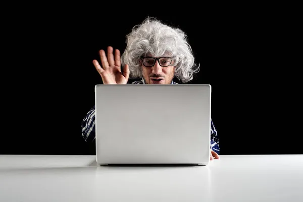 Smiling Man Sitting Desk Having Videochat Laptop Computer Black Background — Stock Photo, Image