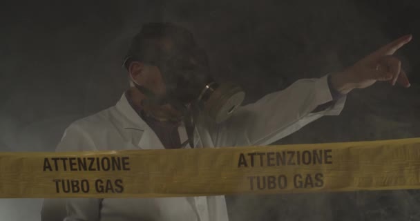 Medical Engineer Wearing Antigas Mask Directing Emergency Indicating Escape Route — Stock Video