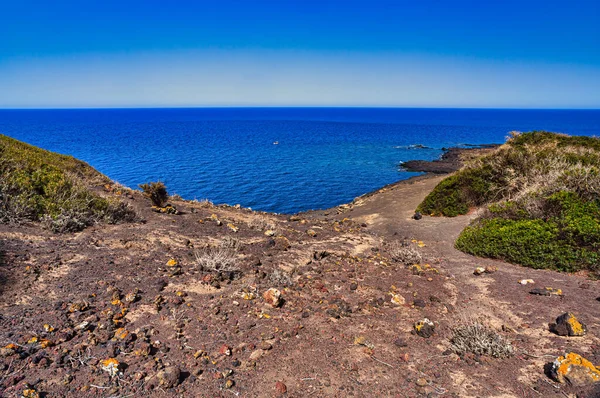 View of the scenic lava rock cliff  in the Linosa island. Sicily