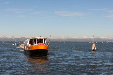 View of the typical vaporetto boat in the Grand Canal in Venice. The vaporetto is a Venetian public waterbus
