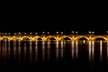 Night view of the famous bridge of Bordeaux called Le Pont de Pierre, Grironde, Aquitaine. France