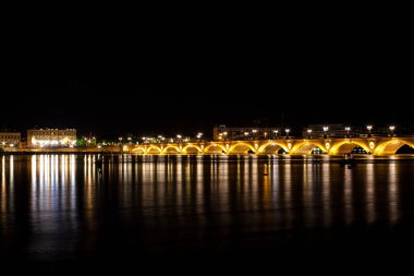 Night view of the famous bridge of Bordeaux called Le Pont de Pierre, Grironde, Aquitaine. France