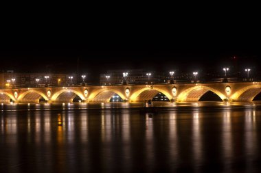 Night view of the famous bridge of Bordeaux called Le Pont de Pierre, Grironde, Aquitaine. France