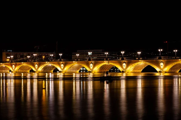 Night view of the famous bridge of Bordeaux called Le Pont de Pierre, Grironde, Aquitaine. France