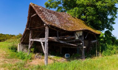 View of old abandoned farmhouse in the landes countryside along Le Puy Route. Way of St. James in France