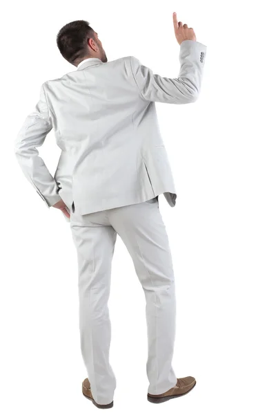 Back view of thinking young business man in white suit. Royalty Free Stock Images