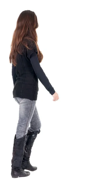 Back view of going woman in jeans and sweater — Stock Photo, Image